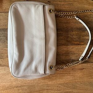 Michael Kors cream colored clutch or shoulder bag with adjustable strap